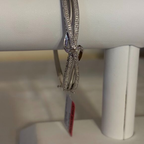 1/10 CT. T.W. Diamond Crossover Bangle Bracelet in Sterling Silver
